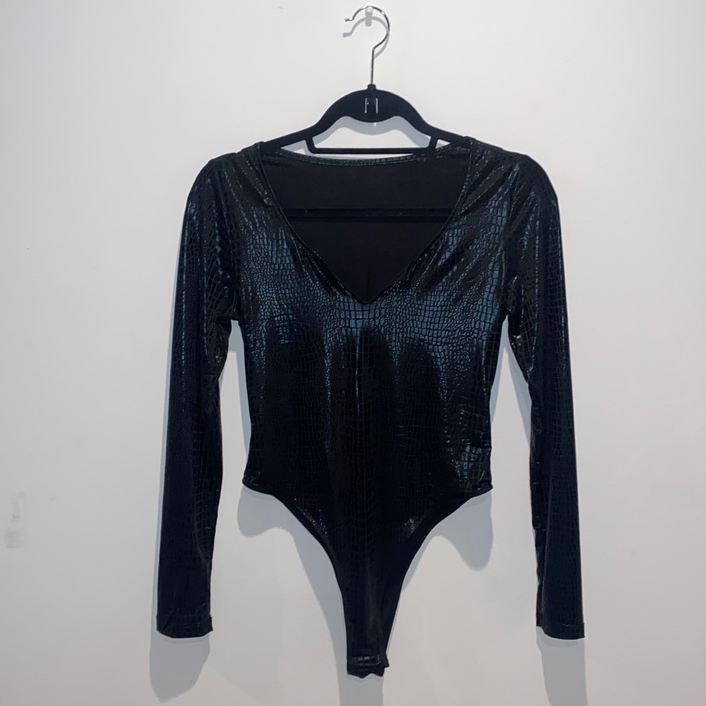 Black body suit. Small. Never warn.